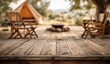 © Mauluddin - Rustic outdoor glamping site with campfire and cozy seating awaits