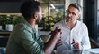 © peopleimages.com - Creative, discussion and men with laptop, office or help with article on web, mentor and journalism. Intern, learning and people with tech for story, teamwork and editing with manager in newsroom