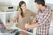 © auremar - a couple checking purchased tools