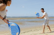 © auremar - young couple playing beach tennis