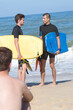 © auremar - young fit bodyboarders on beach