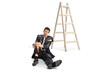 © Ljupco Smokovski - Man in a ripped suit falling from a ladder and holding his painful knee
