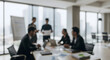 © Saida - A group of businessmen are holding a meeting in a modern office environment with a blurred background.