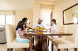 © oneinchpunch - Arab family wearing traditional emirati clothing bonding at home in Dubai