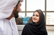 © oneinchpunch - Arab married couple wearing traditional emirati clothing at home - Middle eastern man and woman spending time together, domestic life in a traditional middle east family