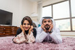© oneinchpunch - Arab married couple wearing traditional emirati clothing at home - Middle eastern man and woman spending time together, domestic life in a traditional middle east family