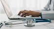 © Lisan - Doctor working on laptop with stethoscope and medical records