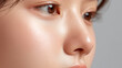 © Marut - Glowing dewy skin with gentle oily highlight surrounding nose and soft pastel tones, close up portrait showing smooth complexion and natural makeup expression