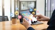 © Noor - Digital engagement with social media: A close-up shot of a person's hands interacting with a digital tablet screen, adorned with vibrant social media icons