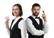 © New Africa - Man and woman working as croupiers on white background. Professional equality
