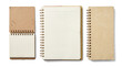 © Christine - a trio of kraft paper notebooks presented side-by-side on a transparent background: a closed small notepad, an open ruled notebook, and a closed spiral-bound notebook, top-down perspective.