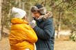 © Pixel-Shot - Young couple holding hands in park on winter day