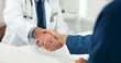 © peopleimages.com - Healthcare, doctor or patient with handshake in office, thank you or greeting for checkup appointment. Gratitude, introduction or people shake hands for medical support, health consultation or clinic