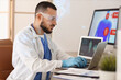 © Pixel-Shot - Male doctor analyzing scientific data at desk in laboratory