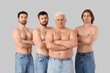 © Pixel-Shot - Group of men on grey background. Body positive concept