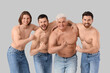 © Pixel-Shot - Group of men showing muscles on grey background. Body positive concept