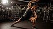 © Muhammad - Muscular man stretches in a gym during a warm-up exercise routine; athletic fitness for active lifestyle and wellness concept