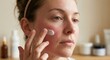 © pansit.me - Woman applying medicated cream to red irritated skin