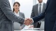 © Studicon - Business handshake shows a deal between two colleagues in the office