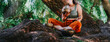 © qunica.com - Friends practice a sound bath with Tibetan singing bowls while seated on tree roots. The group relaxes outdoors under a large willow in the Netherlands.