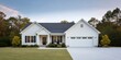 © Andrii Zastrozhnov - White single story suburban house with garage landscaped yard driveway and front porch at dusk modern cottage exterior home