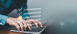 © ภัทรชัย รัตนชัยวงค์ - Business checklist and task management concept with professional typing on laptop and virtual checklist interface with check marks. Workflow planning, productivity control, project management digital