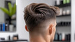 © syhin_stas - Man receiving a professional haircut and modern hairstyle with a sharp fade at a contemporary salon, showcasing grooming, style, and personal care