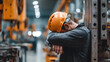© jbstocks - Labor fatigue and workplace stress featuring a factory worker resting on equipment, Generative AI illustrations.