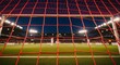 © Image - A soccer goal net on a green field at night with stadium lights shining brightly