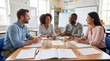 © Anastasiya - Business meeting in training classroom. Meeting team discusses project goals, meeting with coffee mugs and notebooks, collaboration for back to school season, learning concept