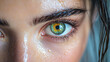 © MasTPX - A captivating close up reveals a young woman's mesmerizing green eye, her skin glistening with moisture, creating an intimate and emotive portrait experience.
