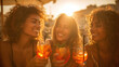 © CinimaticWorks - three women enjoying spritz cocktails at sunset on bar terrace during summer vacation cheerful friendship celebration in golden light relaxed outdoor leisure atmosphere