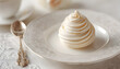 © Oleksiy - Refined french dessert on plate. Spiral shaped meringue with delicate cream. Elegance in design.