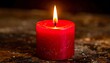 © Anggi - Close-up red candle with a soft glowing flame creating a warm and intimate atmosphere in a minimal scene with subtle light and gentle shadows
