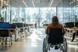 © Gzvzattio - person in a wheelchair in a sunlit open-plan office with rows of desks, computers and large glass windows, conveying a calm, contemplative and hopeful mood