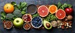 © zhuan - A colorful top down spread of fresh fruits and vegetables with nuts seeds grains citrus halves berries avocado greens and bowls of chia and almonds
