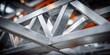 © NovaVision - Close-up view of a metallic truss structure with geometric patterns and industrial feel