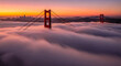 © Creativity here - The golden gate bridge stands tall above a thick blanket of morning fog at a beautiful sunrise.
