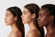© Sanddogfx - Three women of varying skin tones in profile, celebrating beauty and diversity against a minimalist white backdrop.