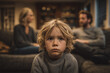 © sahruddin - A small child sits sadly between his parents who are arguing during a divorce, an emotional scene of family conflict.