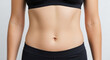 © Arra Vais - Healthy adult torso showing subtle body fat around waist. Woman's midsection displays natural curves, emphasizing normal body shape with subtle body fat. Concept for health articles, fitness journeys.