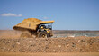 © electra kay-smith - Western Australia mining town of Kalgoorlie a heavy mining dump truck hauling dirt across open pit