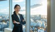 © nanakusa - オフィスの窓辺で腕を組み、都会の景色を背に微笑む日本人女性リーダー