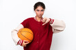© luismolinero - Young basketball player woman isolated on white background showing thumb down with negative expression