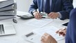 © rogerphoto - Male financial analysts with female colleague examining documents, using magnifying glass and calculator at workplace in office. Audit and taxes in business