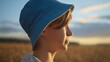 © vla - profile of a happy boy in the golden field looking at the sky and smiling, have fun and enjoy