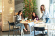 © ADDICTIVE STOCK - Three businesswomen collaborating in a modern office