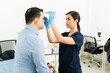 © AntonioDiaz - Doctor marking the scalp outline of a man receiving a hair restoration procedure for male pattern baldness