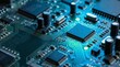 © Mimie - Close up view of a complex electronic circuit board with integrated chips and capacitors illuminated by blue light