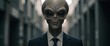 © NN AI - Portrait of grey alien wearing professional business suit. Extraterrestrial character in formal attire in modern office hallway. Sci-fi concept of alien businessman